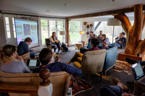 All-hands meeting in a lobby All-hands meeting in a lobby